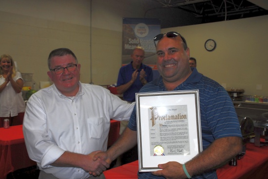 Mayor of Walton Hills presenting plaque to NPK's president