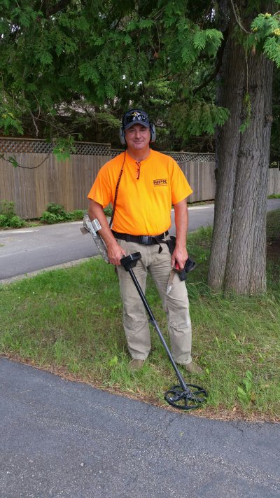 Jamie Wright, NPK Northwest Territory Manager, with his metal detector